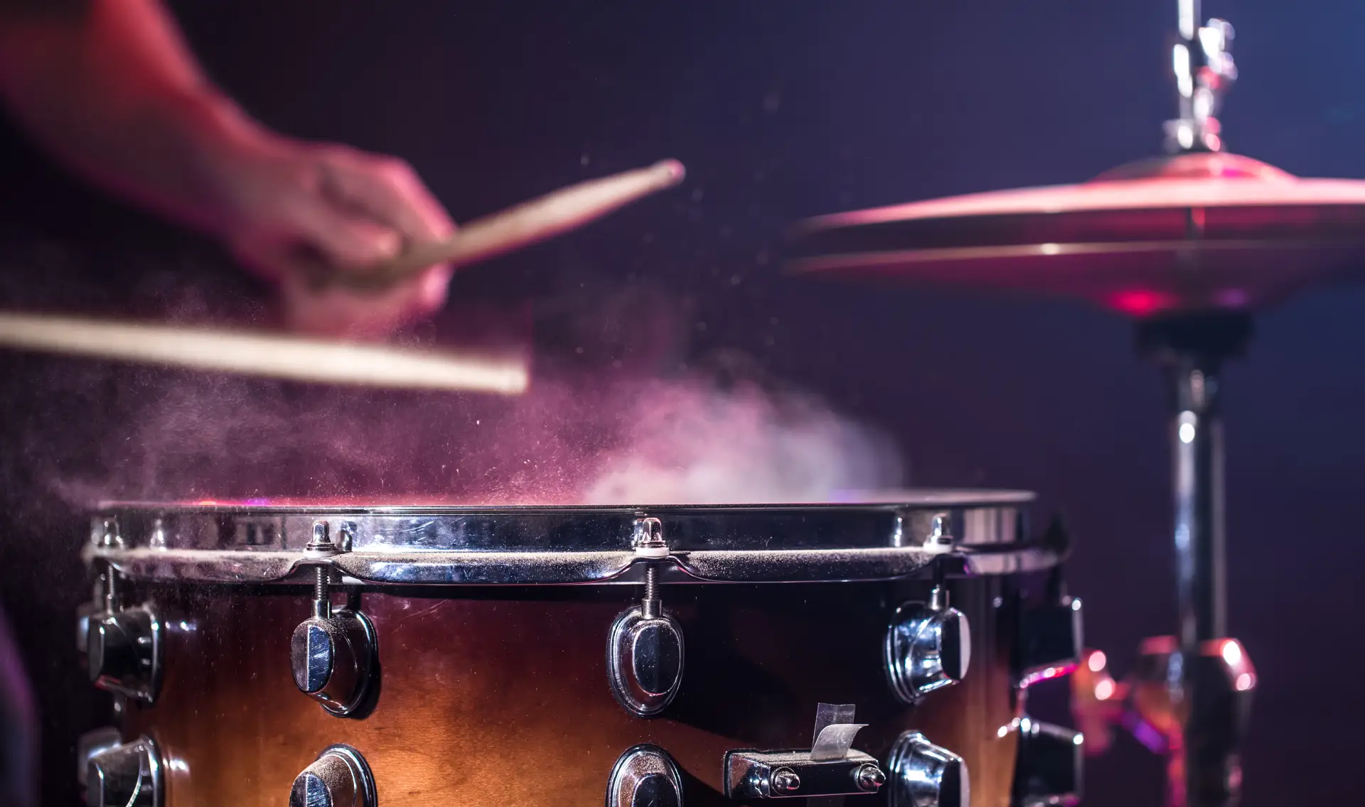 Energetic drummer performing with sticks