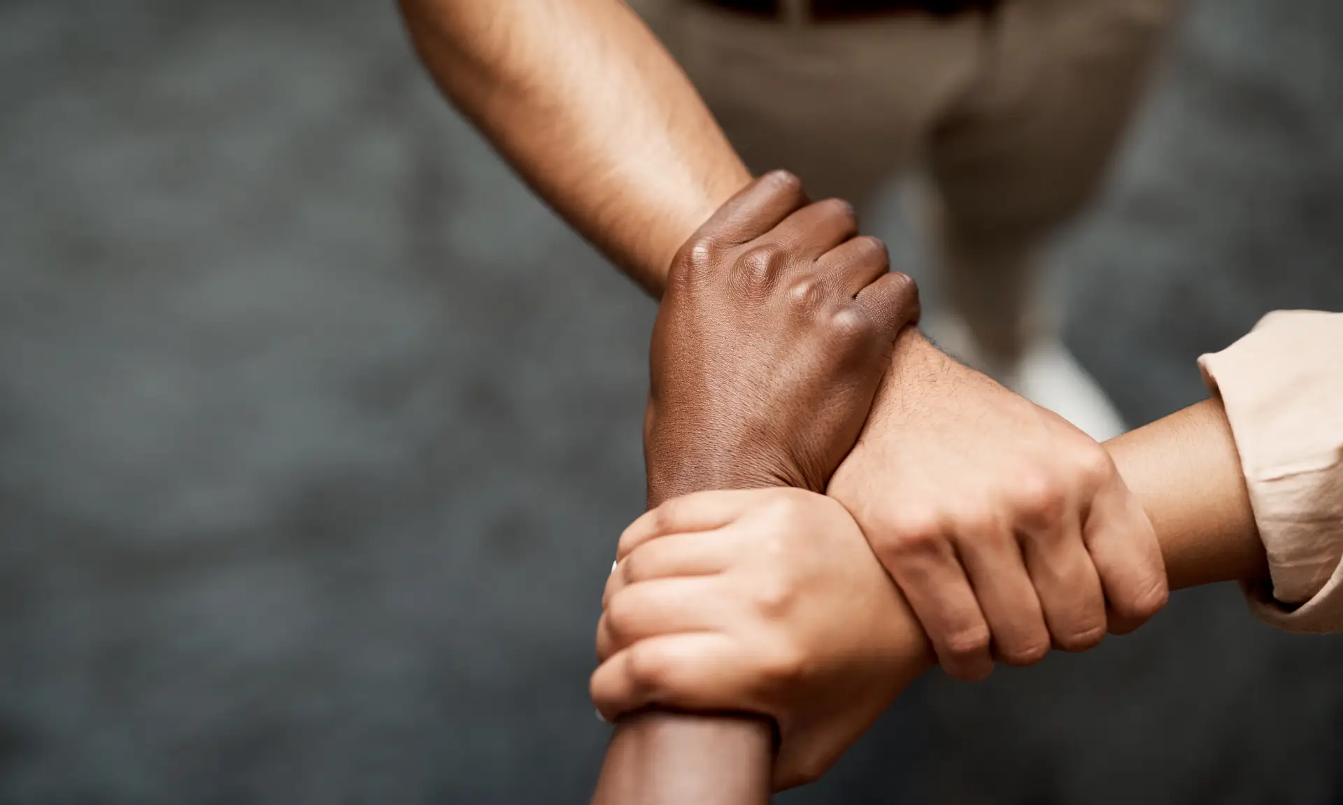 Shot of a group of musicians linking arms